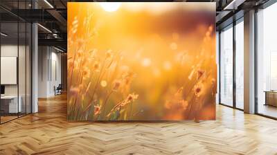 Meadow grass flower with dewdrops in the morning with golden sunrise sky. Selective focus on grass flower on blur bokeh background of yellow and orange sunshine. Grass field with sunrise sky. 
 Wall mural